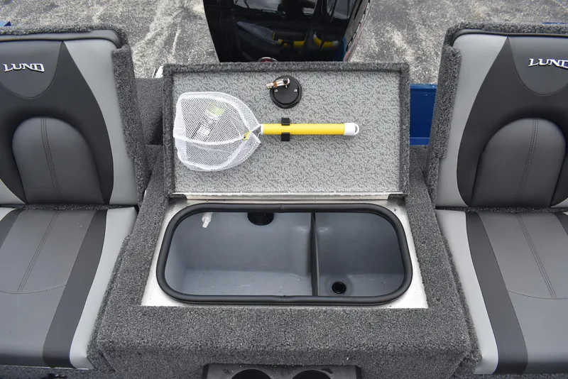 Slide: The Image of 2026 Lund 1775 Adventure Sport boat interior with storage compartment and fishing net. - 14