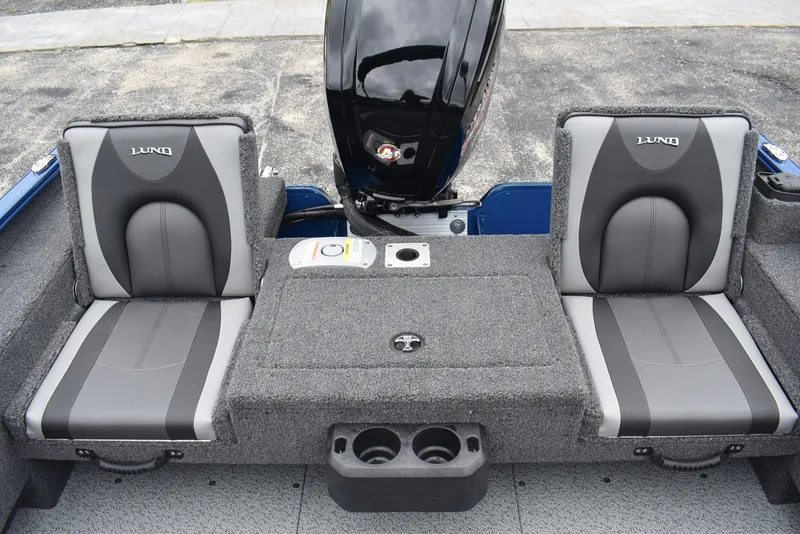 Slide: The Image of 2026 Lund 1775 Adventure Sport boat interior with gray seating and motor. - 9