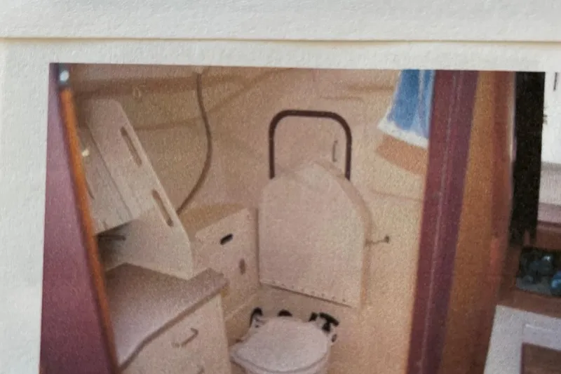 Slide: The Image of Interior of a 1998 Hunter 340 sailboat bathroom with compact design. - 22