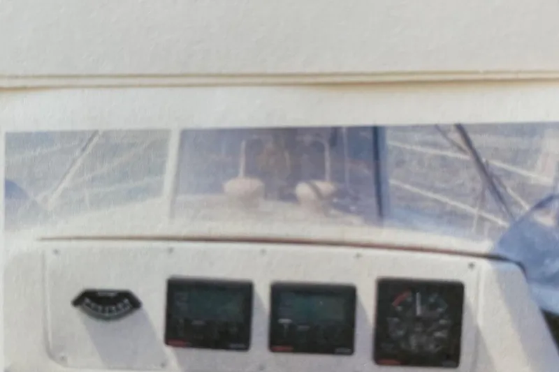 Slide: The Image of Cockpit instruments of a 1998 Hunter 340 sailboat, featuring navigation displays. - 6