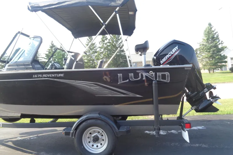 Slide: The Image of 2022 Lund 1675 Adventure Sport boat with Mercury outboard motor on trailer. - 10