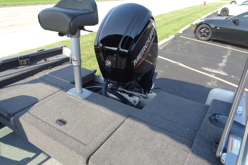 Slide: The Image of 2022 Lund 1675 Adventure Sport boat with Mercury outboard motor, parked on asphalt. - 11