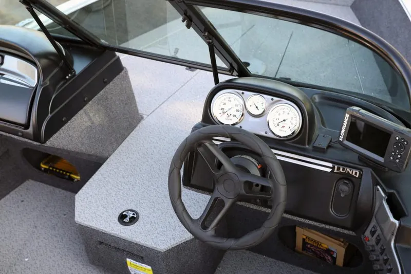 Slide: The Image of Manufacturer Provided Image: 2022 Lund 1675 Adventure Sport boat dashboard with steering wheel and gauges. - 19