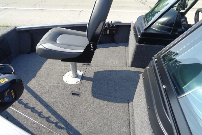 Slide: The Image of 2022 Lund 1675 Adventure Sport boat interior with seating and windshield. - 9