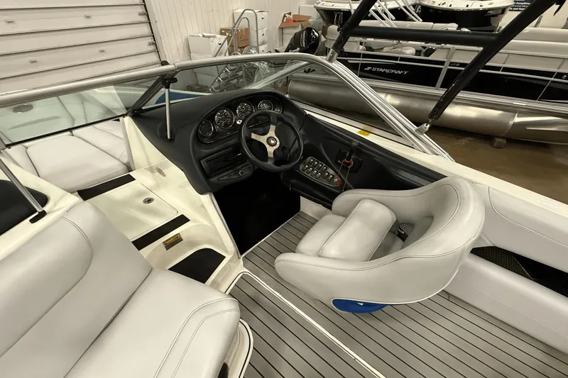 Slide: The Image of 2004 Centurion Avalanche C4 boat interior with steering wheel and seating. - 10
