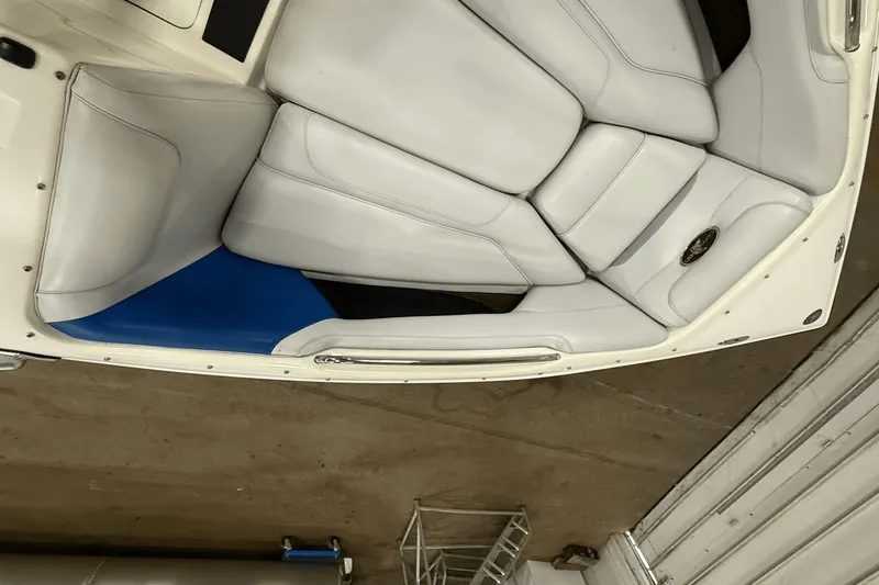 Slide: The Image of 2004 Centurion Avalanche C4 boat interior with white and blue seating. - 16