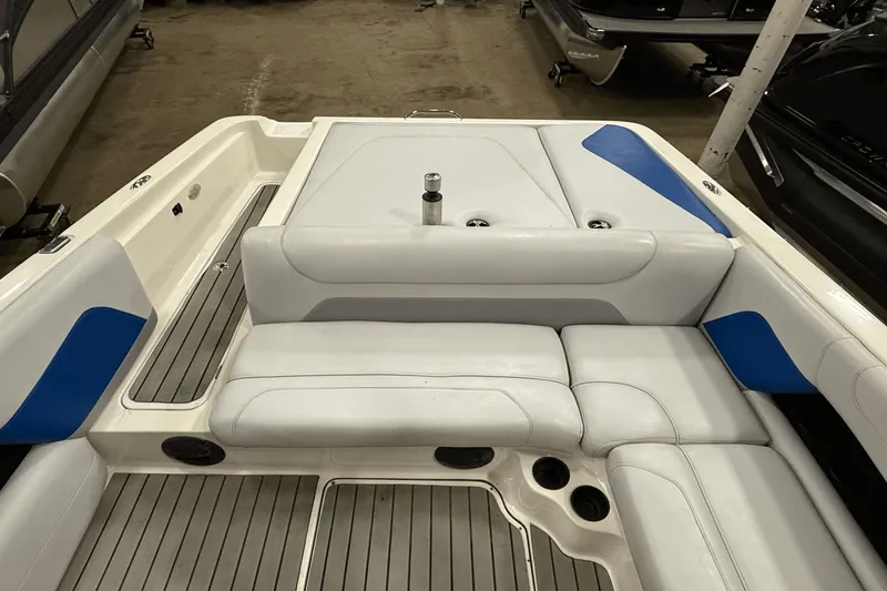Slide: The Image of 2004 Centurion Avalanche C4 boat interior with white and blue seating. - 8