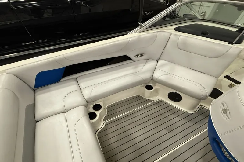 Slide: The Image of 2004 Centurion Avalanche C4 boat interior with white seating and gray flooring. - 9