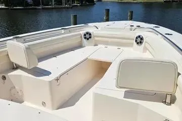 Slide: The Image of 2022 Grady-White Canyon 336 boat interior with spacious seating and water view. - 13