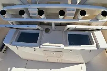 Slide: The Image of 2022 Grady-White Canyon 336 fishing station with rod holders and storage compartments. - 26