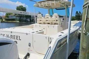 Slide: The Image of 2022 Grady-White Canyon 336 boat docked by the water. - 6