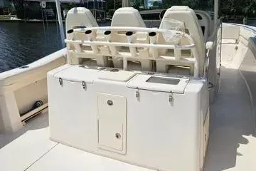 Slide: The Image of 2022 Grady-White Canyon 336 boat interior with seating and storage compartments. - 8