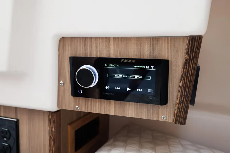 Slide: The Image of Audio control panel in Solara S-310 SB, 2026 model, featuring Bluetooth connectivity. - 28