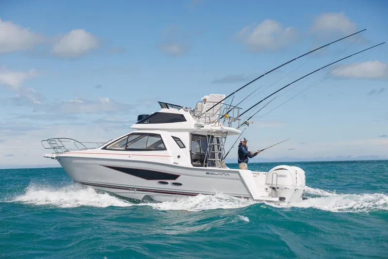 Slide: The Image of 2026 Solara S-310 SB boat cruising with fishing rods in ocean waters. - 5