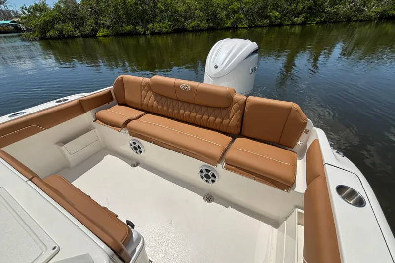 Slide: The Image of 2026 Key West 239 FSR boat with tan seating and Yamaha engine on calm water. - 6