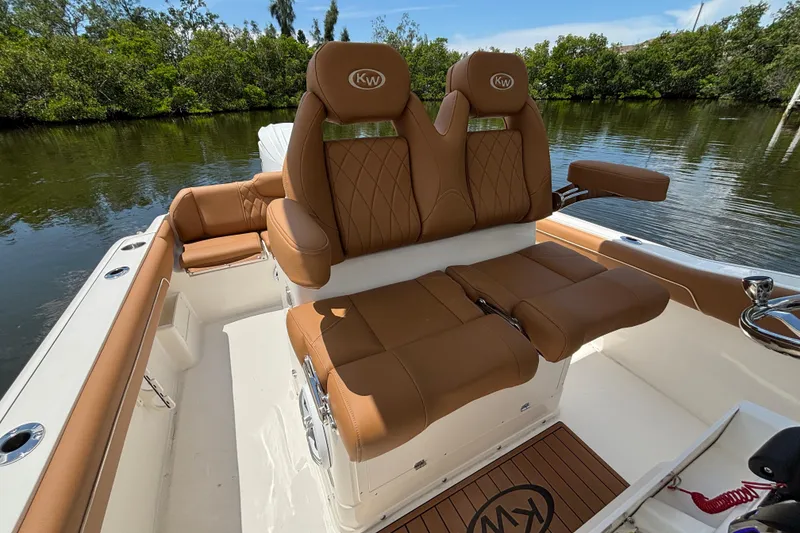 Slide: The Image of 2026 Key West 239 FSR boat interior with luxurious brown leather seating. - 9