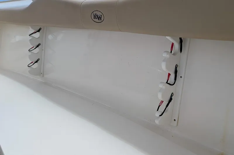 Slide: The Image of 2014 Key West 219 FS boat interior with rod holders and KW logo. - 10