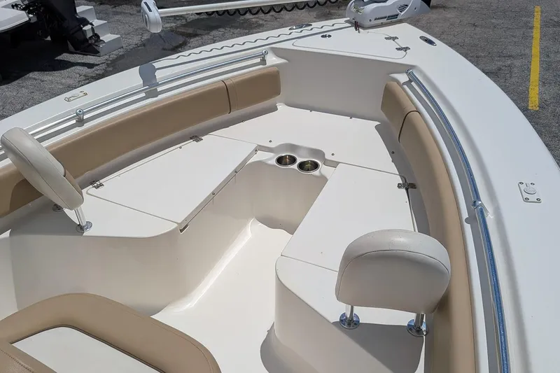 Slide: The Image of 2014 Key West 219 FS boat interior with seating and cup holders. - 15
