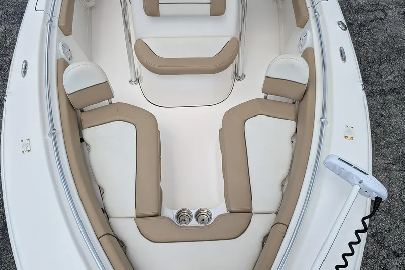 Slide: The Image of 2014 Key West 219 FS boat interior with beige and white seating arrangement. - 18