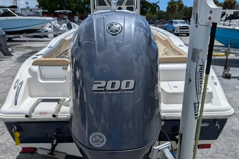 Slide: The Image of 2014 Key West 219 FS boat with Yamaha 200 engine, displayed outdoors. - 5