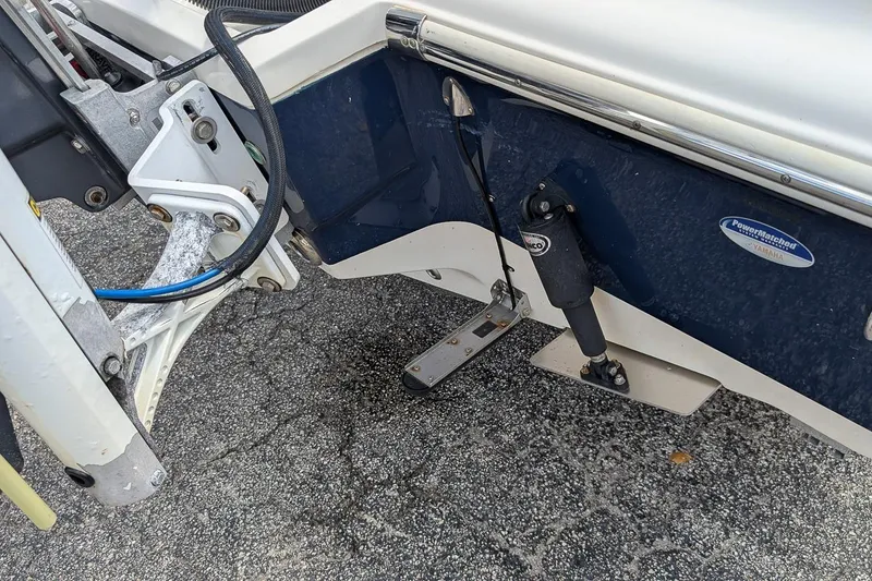 Slide: The Image of 2014 Key West 219 FS boat transom with trim tab and hydraulic components. - 6