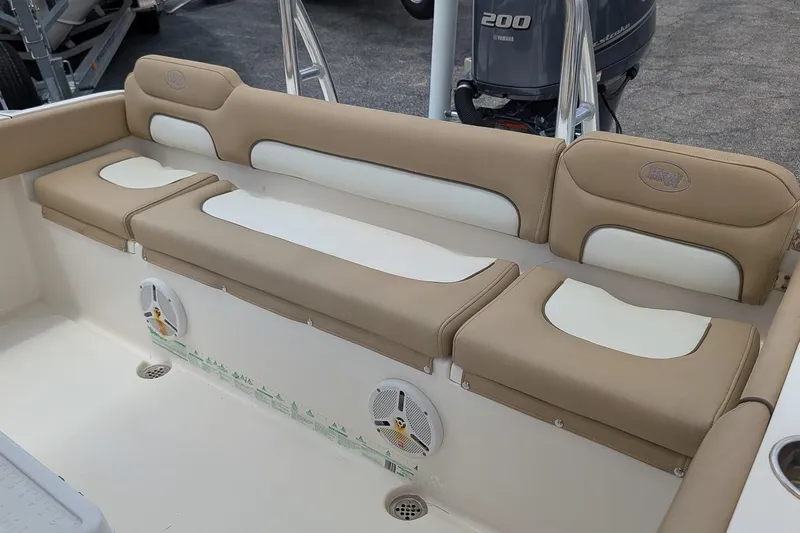 Slide: The Image of 2014 Key West 219 FS boat interior with beige and white cushioned seating. - 8