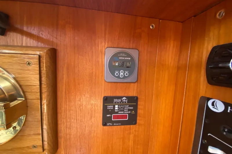 Slide: The Image of Control panel on 2003 Hunter 386 sailboat with Victron Energy and Blue Sky displays. - 18