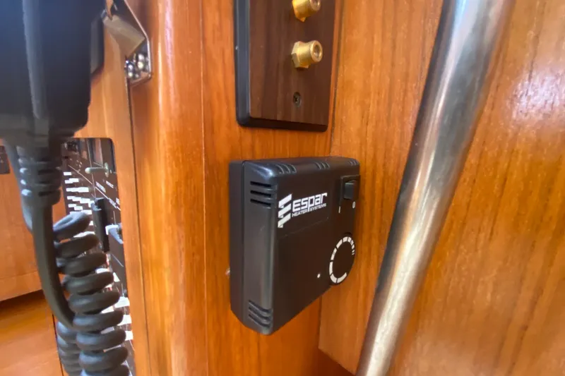 Slide: The Image of Espar heater control on 2003 Hunter 386 yacht's wooden interior panel. - 19