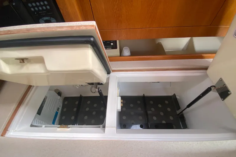 Slide: The Image of Interior view of a 2003 Hunter 386 yacht's storage compartments. - 30