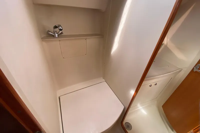 Slide: The Image of Compact bathroom in 2003 Hunter 386 sailboat with sink and shower area. - 43