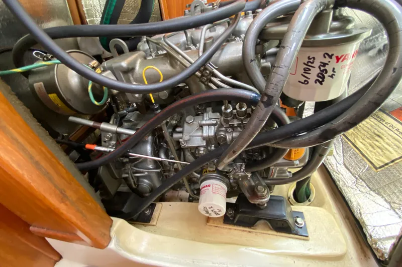 Slide: The Image of Engine compartment of a 2003 Hunter 386 sailboat, featuring detailed mechanical components. - 47