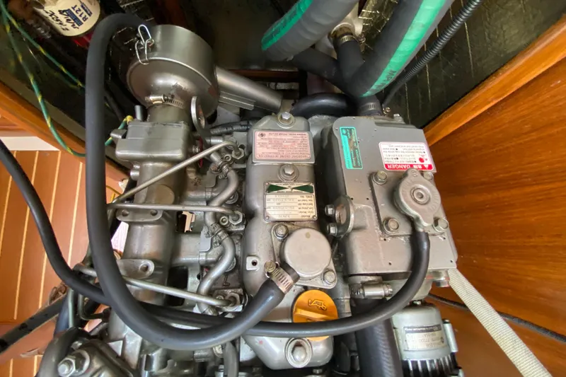 Slide: The Image of Engine compartment of a 2003 Hunter 386 sailboat, showing detailed mechanical components. - 49
