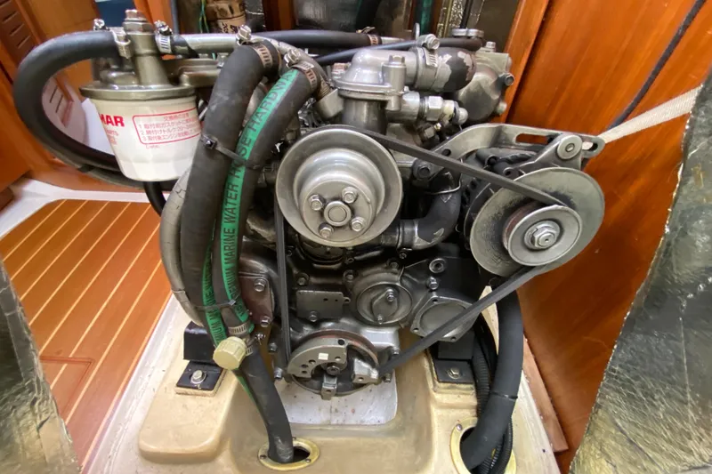 Slide: The Image of Engine of a 2003 Hunter 386 sailboat with visible belts and hoses. - 50