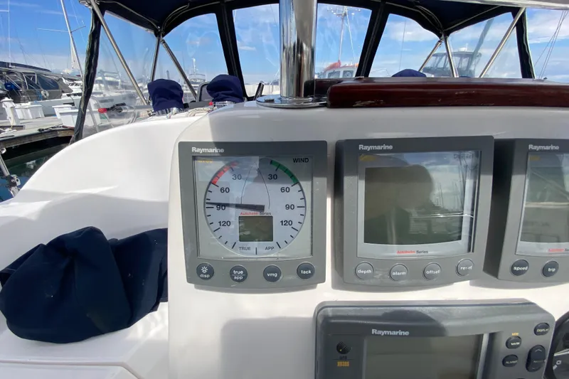 Slide: The Image of Cockpit of 2003 Hunter 386 sailboat with Raymarine navigation instruments. - 56