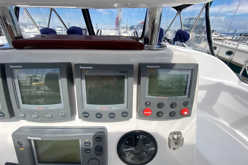 Slide: The Image of Control panel of a 2003 Hunter 386 sailboat with Raymarine displays. - 57