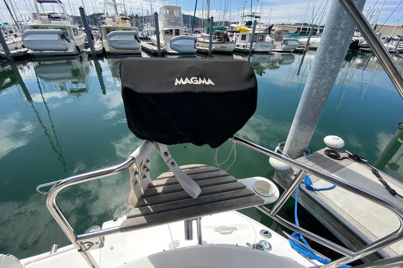 Slide: The Image of Hunter 386 sailboat with Magma grill at marina, 2003 model. - 62