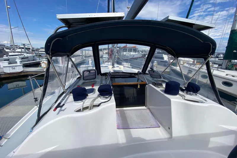 Slide: The Image of Cockpit view of a 2003 Hunter 386 sailboat docked at a marina. - 68