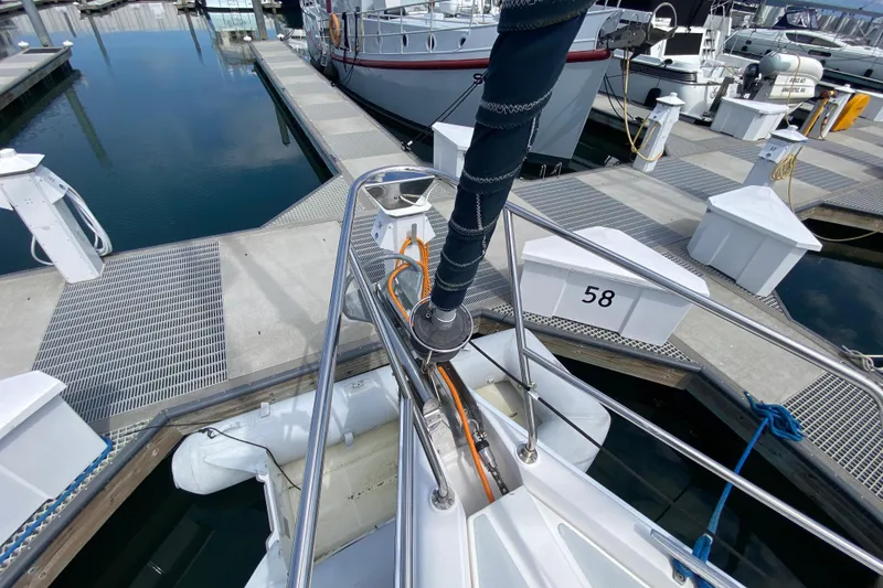 Slide: The Image of Bow of a 2003 Hunter 386 sailboat docked at marina slip 58. - 74