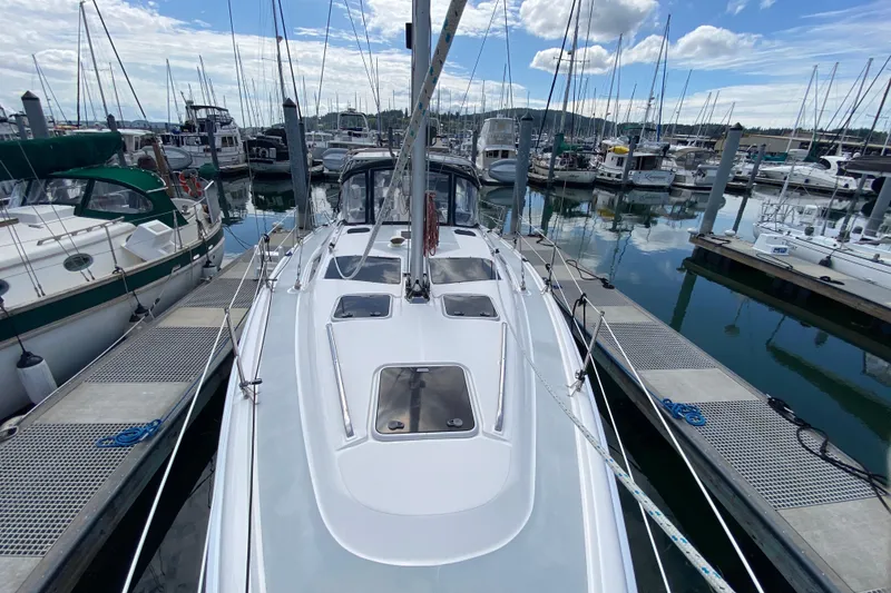 Slide: The Image of Sailboat docked at marina, Hunter 386, 2003 model, surrounded by other boats. - 76
