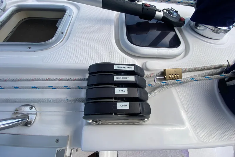 Slide: The Image of Sailing yacht Hunter 386 deck with labeled rope clutches and combination lock, 2003 model. - 78