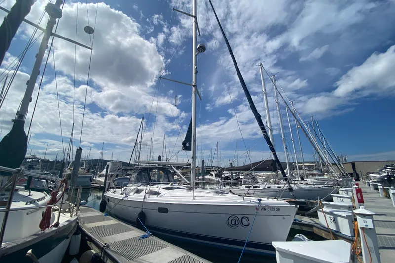 Slide: The Image of Sailboat docked at marina under cloudy sky, Hunter 386, 2003 model. - 80