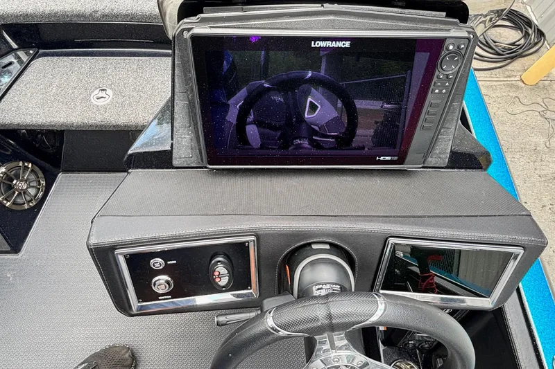 Slide: The Image of 2022 Ranger Z520R boat dashboard with Lowrance display and steering wheel. - 10