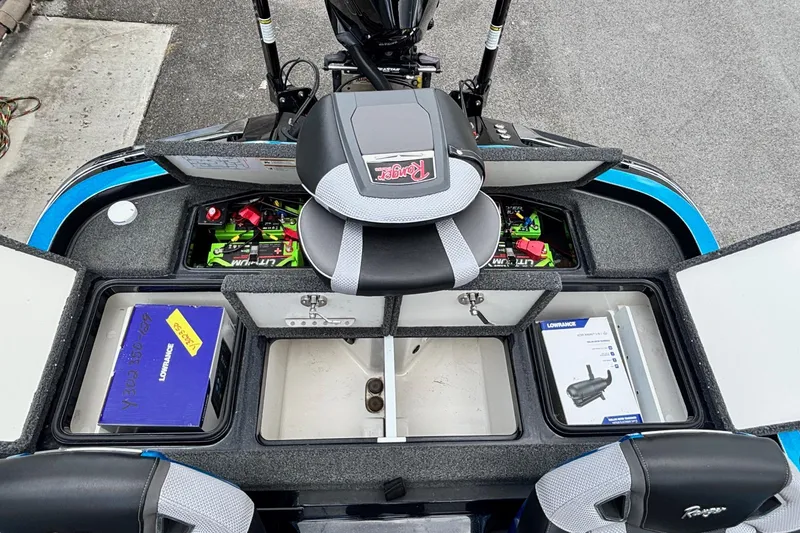 Slide: The Image of 2022 Ranger Z520R boat interior with storage compartments and equipment. - 13