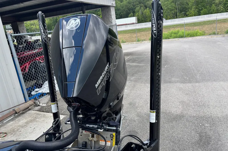 Slide: The Image of 2022 Ranger Z520R boat with Mercury Pro engine and Power-Pole anchors in a parking area. - 16