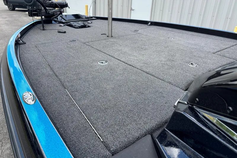 Slide: The Image of 2022 Ranger Z520R Ranger Cup Equipped boat deck with gray carpeting and blue trim. - 4