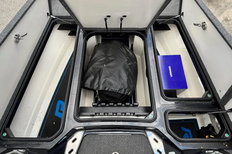 Slide: The Image of 2022 Ranger Z520R boat storage compartments with gear and equipment. - 7