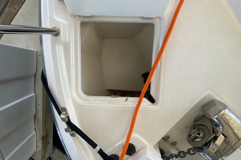 Slide: The Image of 2019 Ranger Tugs R-29 S boat compartment with orange cable and anchor chain. - 10