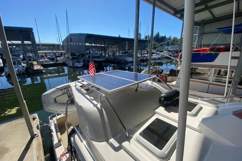Slide: The Image of 2019 Ranger Tugs R-29 S with solar panel docked at marina. - 23