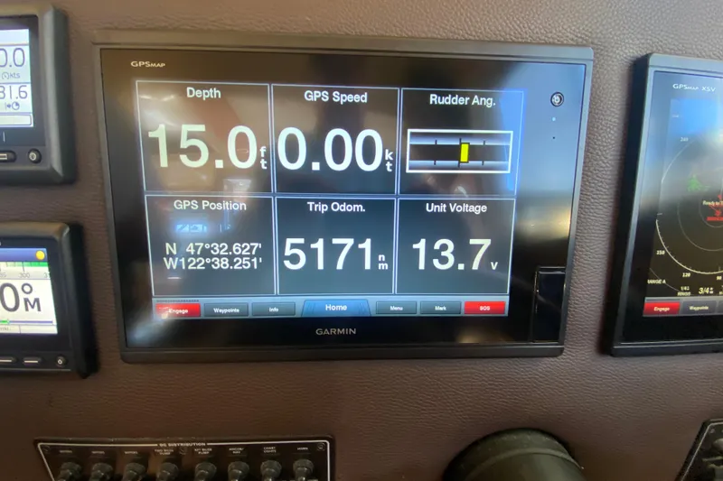 Slide: The Image of Garmin display on 2019 Ranger Tugs R-29 S showing depth, GPS, and voltage. - 56