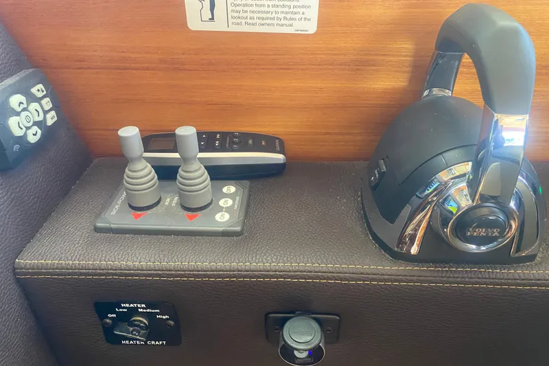 Slide: The Image of 2019 Ranger Tugs R-29 S control panel with joystick and Volvo Penta throttle. - 59